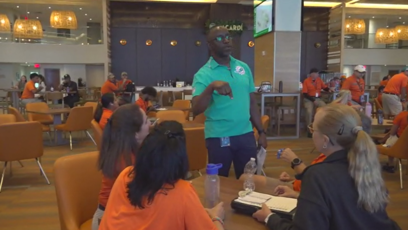 Miami Dade College professor finds his passion with side job at Hard Rock Stadium — CBS Miami, Fort Worth Arts news