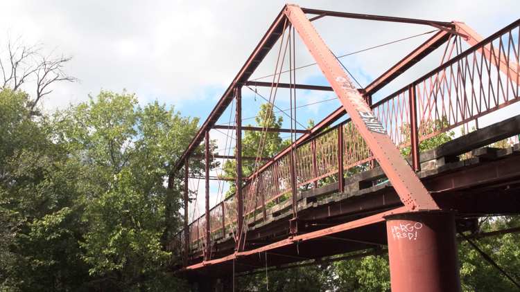 Old Alton Bridge, also known as Goatman's Bridge, at sunset in Denton, Texas